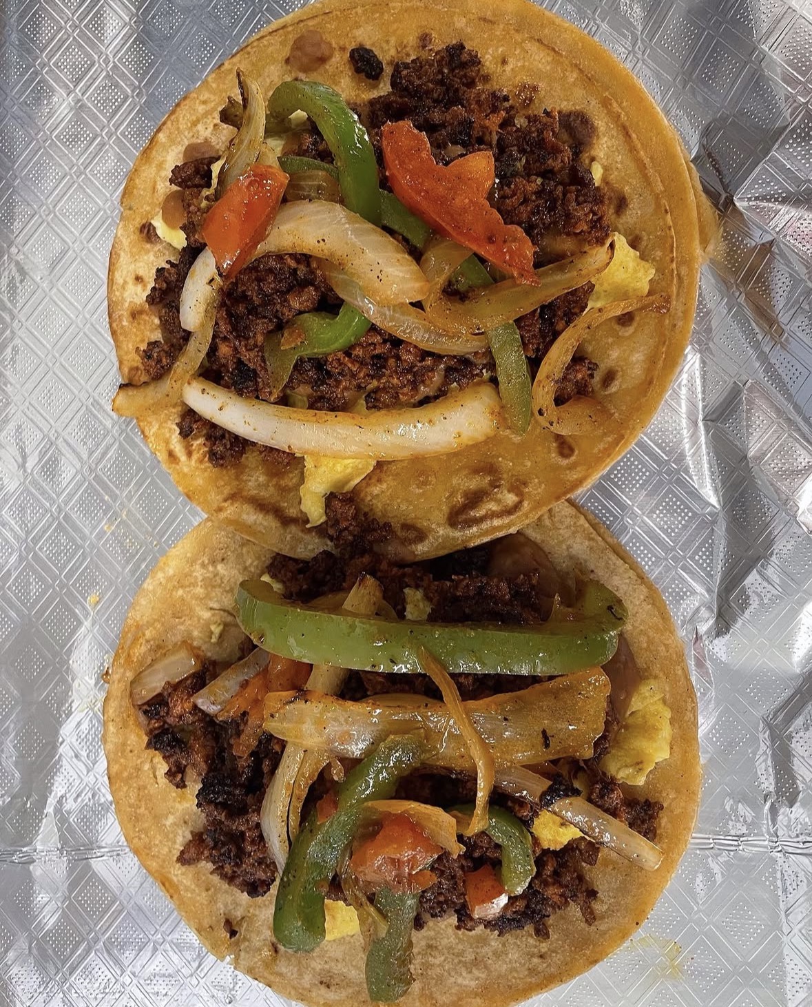 Chorizo fajita tacos with grilled peppers and onions